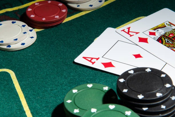 Live baccarat table with dealer, cards, and betting layout